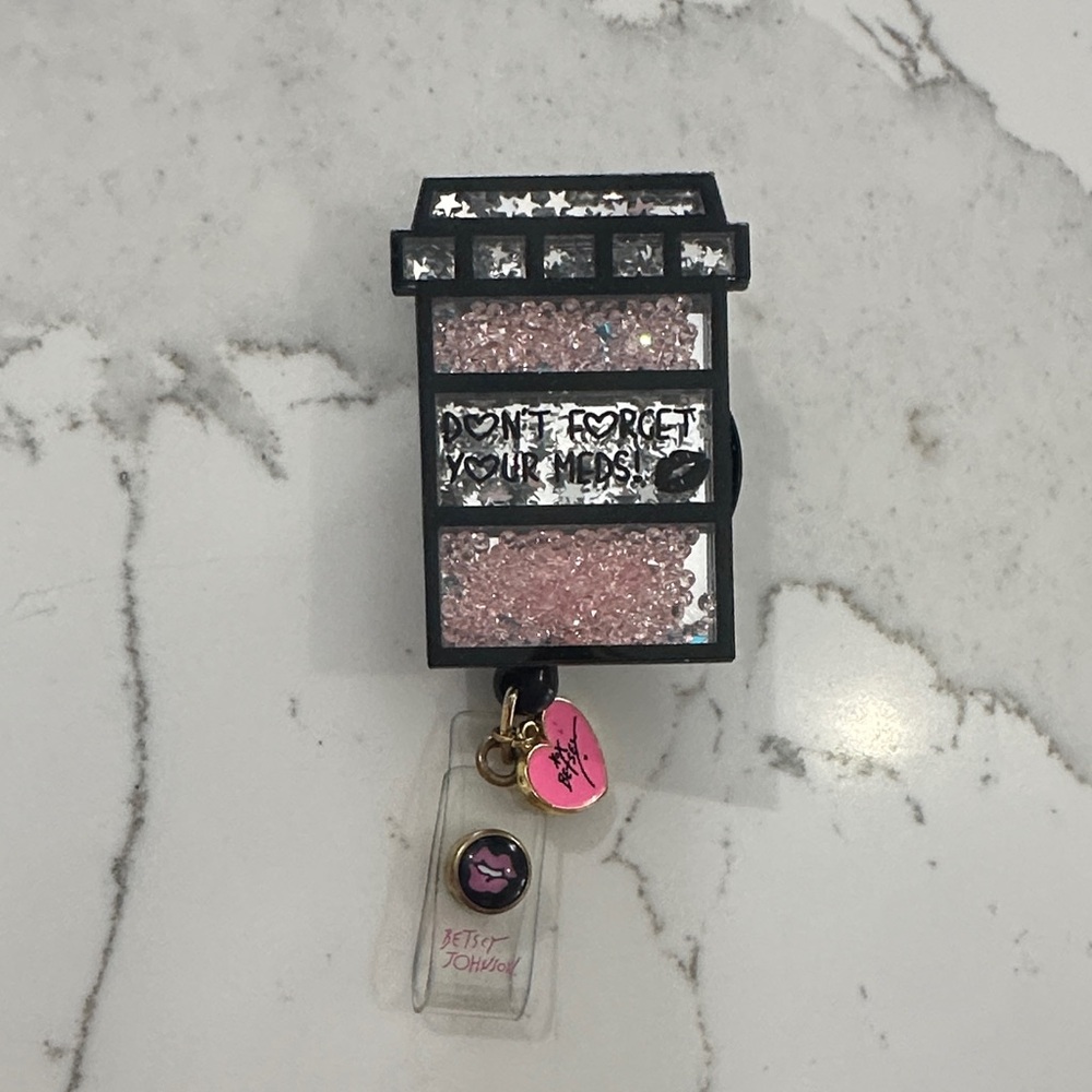 Betsey Johnson shaker name badge reel